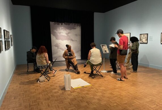 Participants write in a gallery at the Detroit Institute of Arts