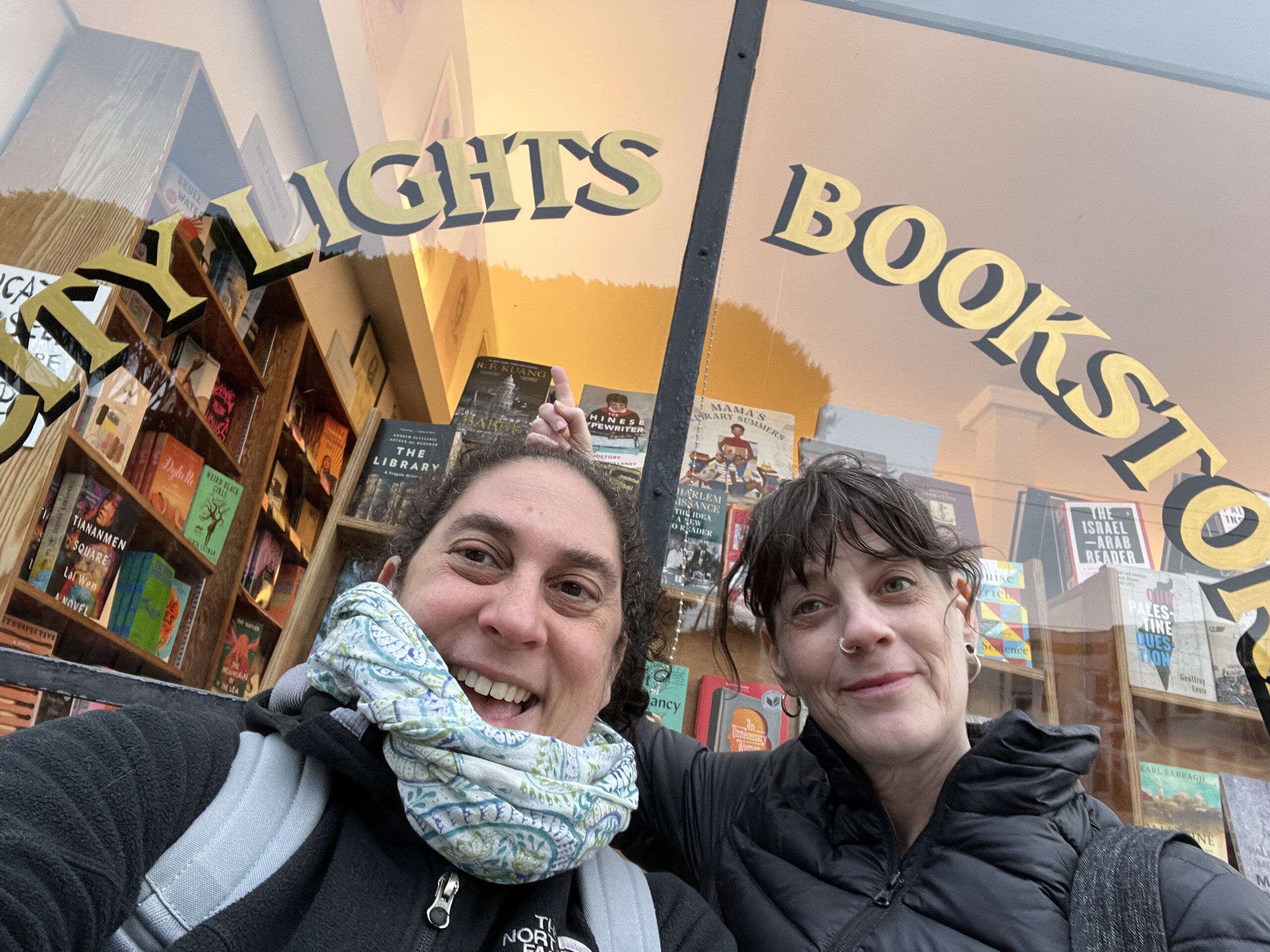 Suma Karaman Rosen stands with a friend outside of Citylights Bookstore in San Francisco.