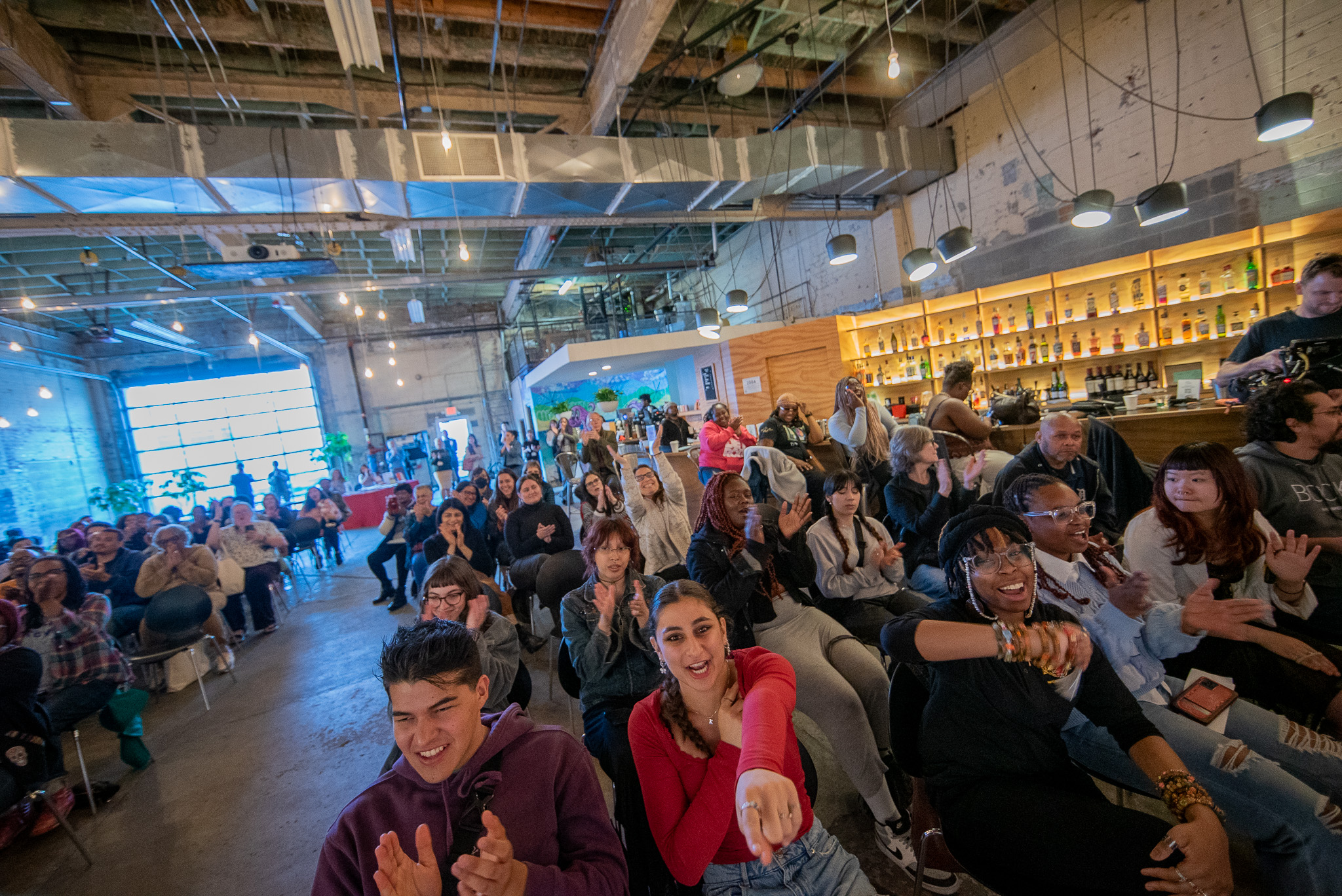 Poetry slam audience claps and cheers